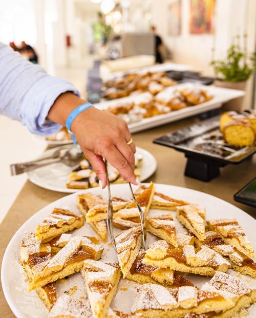 Hand picks sugary delight, aroma of tart, a feast for the senses.